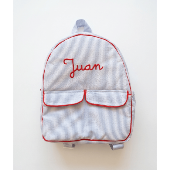 Mochila infantil impermeable raya azul con bordado